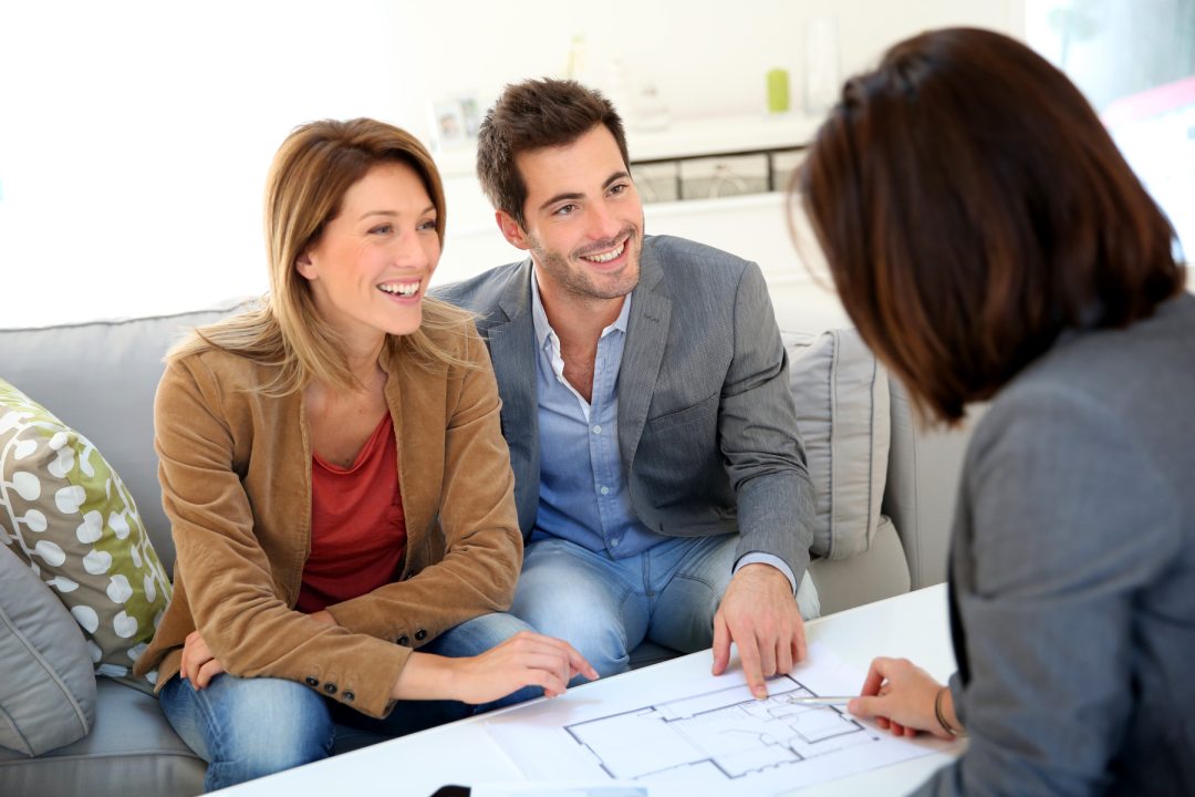 Couple meeting architect for house construction