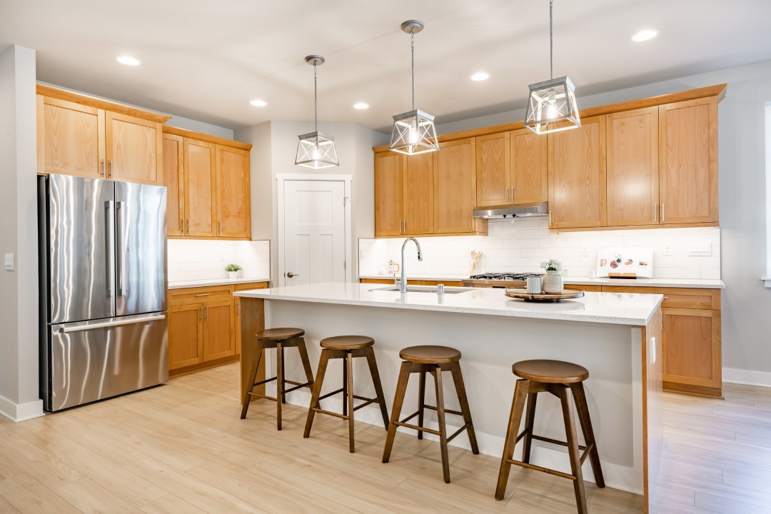 Home kitchen interior with island.